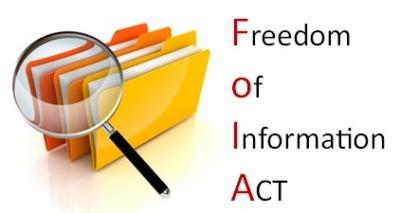 Freedom of Information Act image with File Folders and a magnifying glass